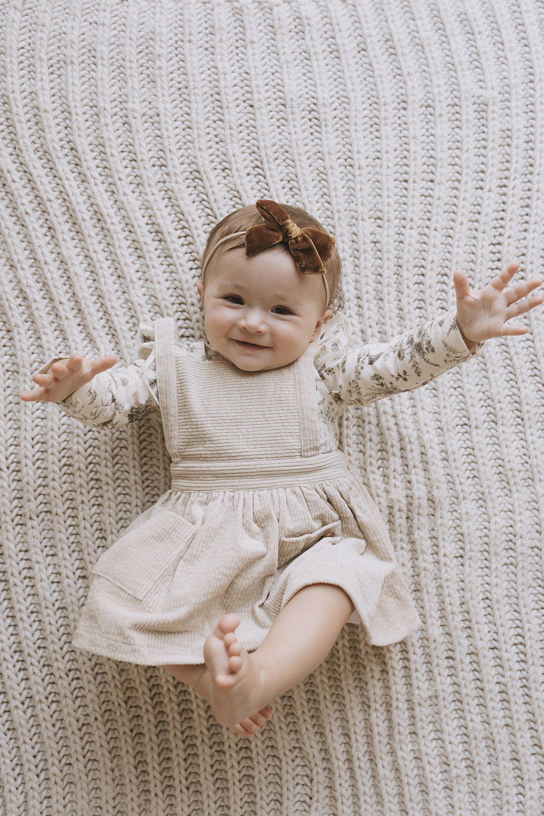 white pinafore baby dress