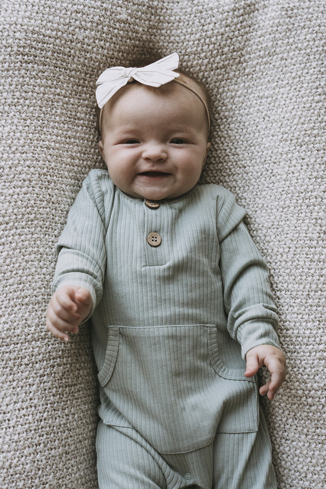 Sage ribbed playsuit on baby